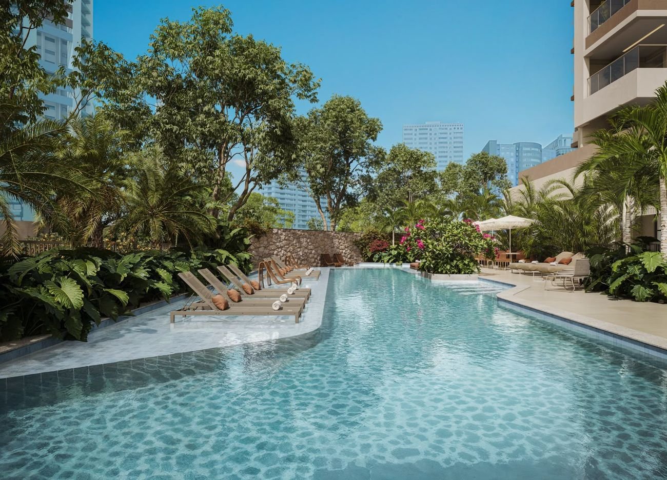Piscina externa com raia de 25 metros e deck solário no Kronos by Tegra Barra da Tijuca