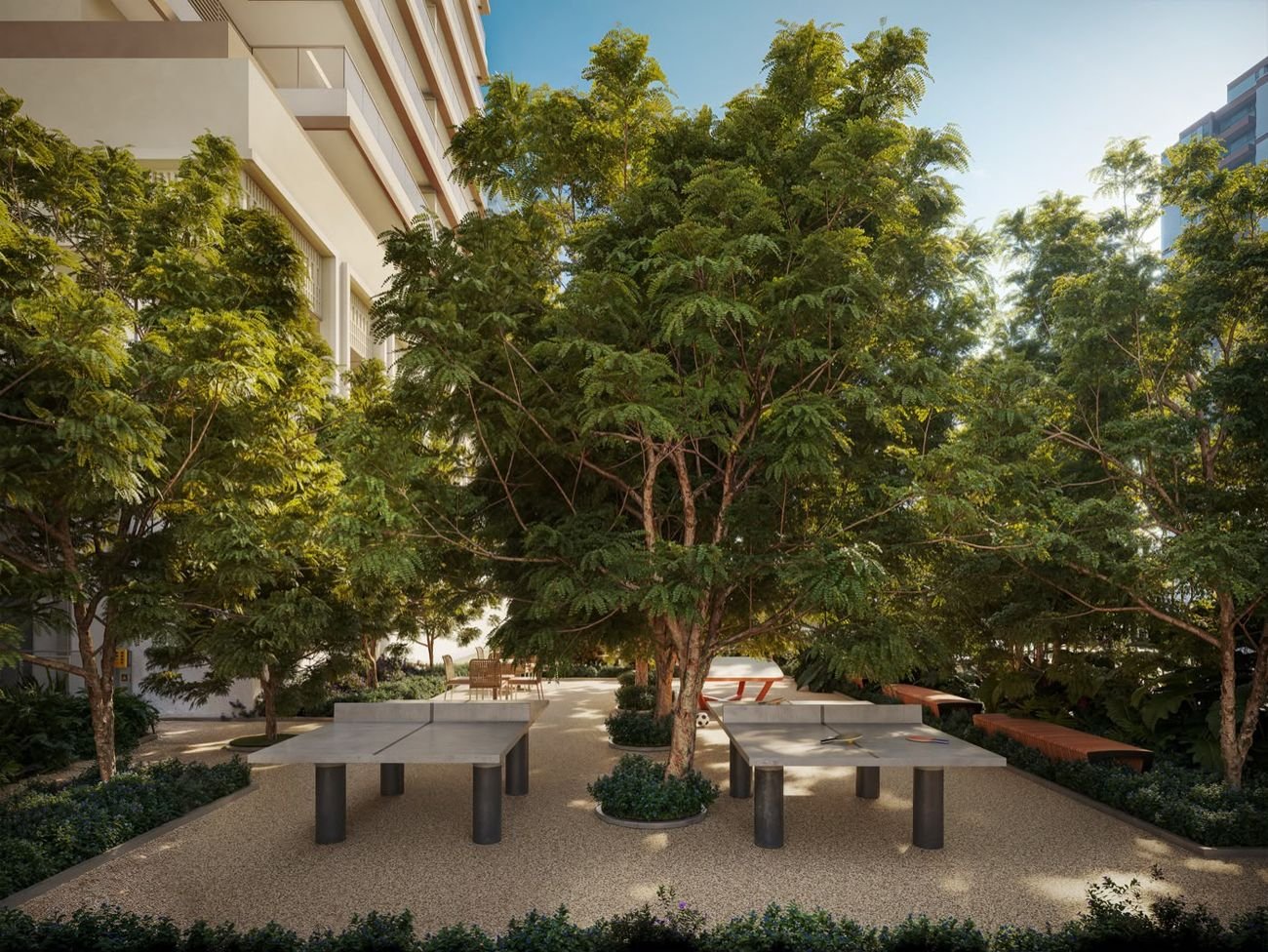 Mesas de pingue-pongue em praça arborizada no Kronos by Tegra Barra da Tijuca