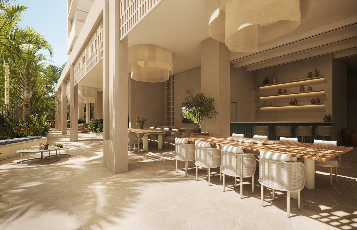 Varanda gourmet com mesas comunitárias no Kronos by Tegra Barra da Tijuca